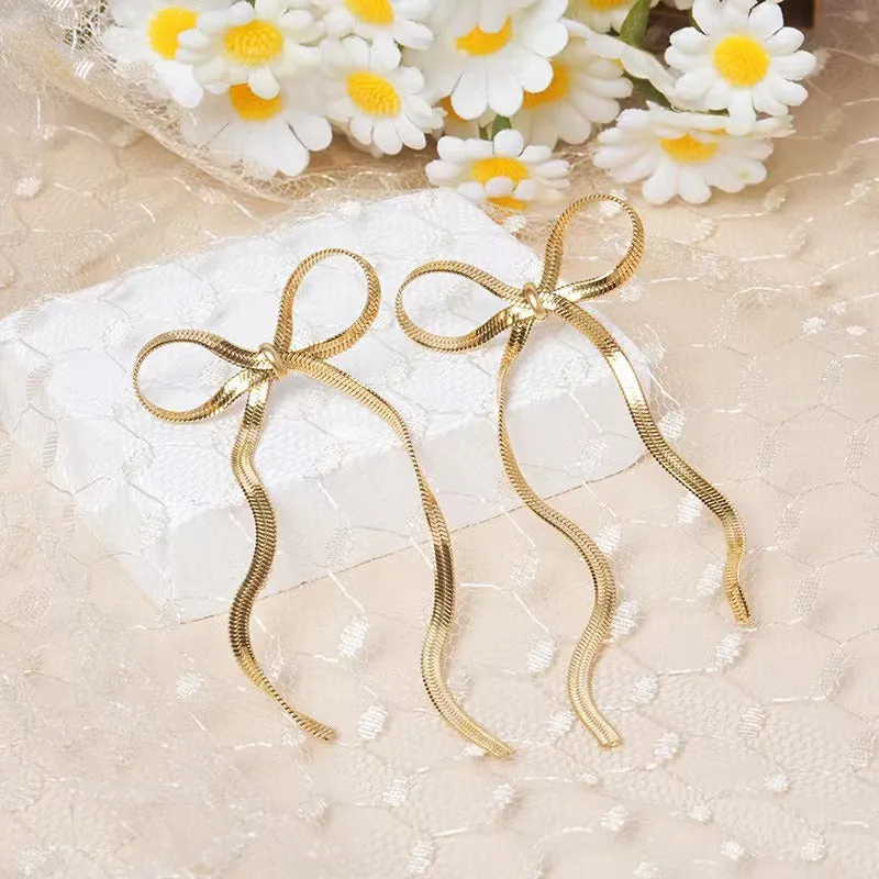 Pre Order:  Long Bow Minimalist Earrings