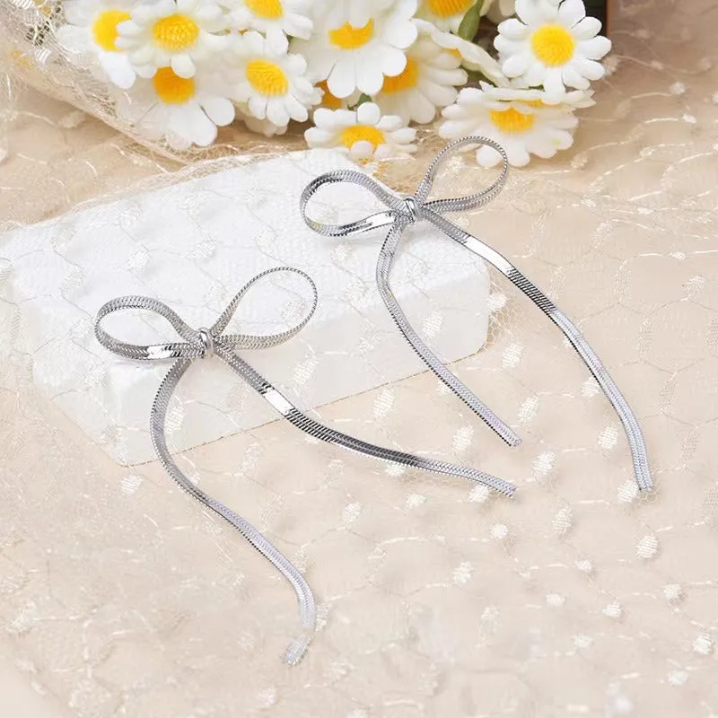 Pre Order:  Long Bow Minimalist Earrings